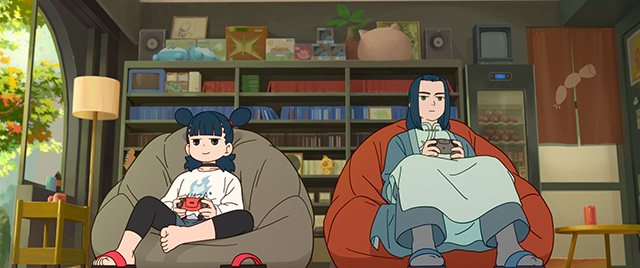 ソファに腰かけながらゲームをするナタとムゲン